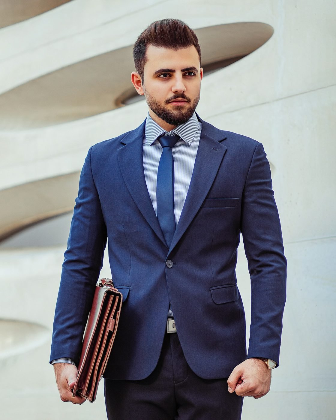 Businessman in a navy suit with a briefcase